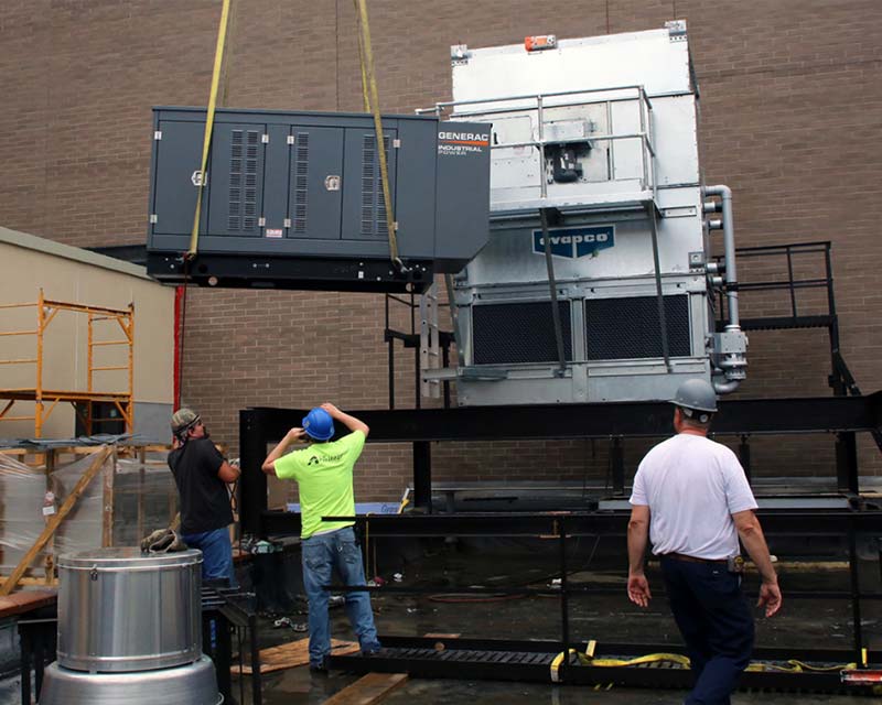 C.M. Armitage workers working on Hilton Garden Inn exterior